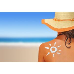 Woman with sun shaped sunscreen on her back Bemotrizinol